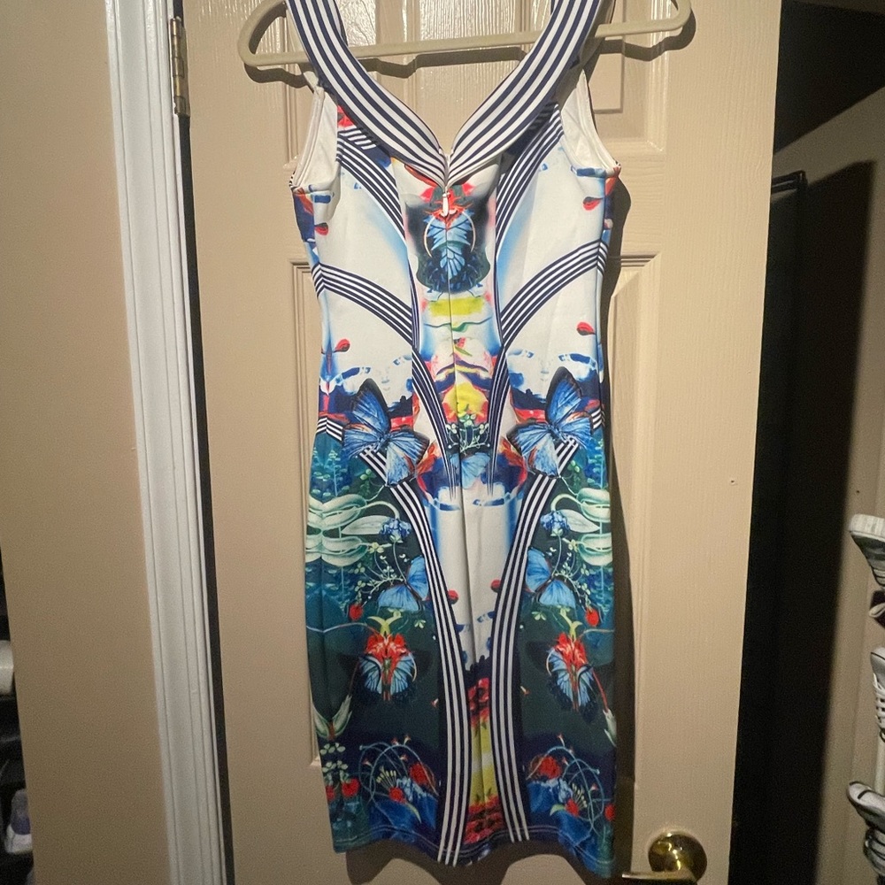 Designer.  Thick stretch material.  Can be worn Slightly off shoulder